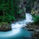 Cascate di Riva nelle Dolomiti in Trentino Alto Adige con abeti ai lati